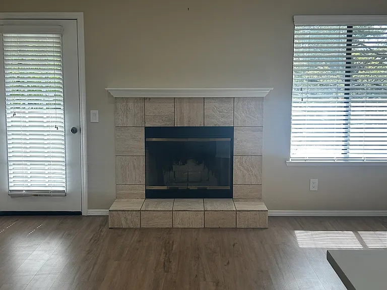 Wood burning fireplace with laminate floors throughout!