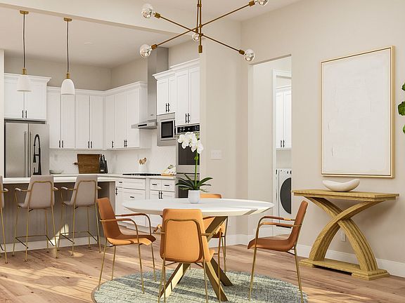 The kitchen and dining room sit adjacent to one another.