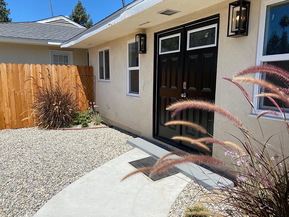 Double door entry from private fenced in entrance.