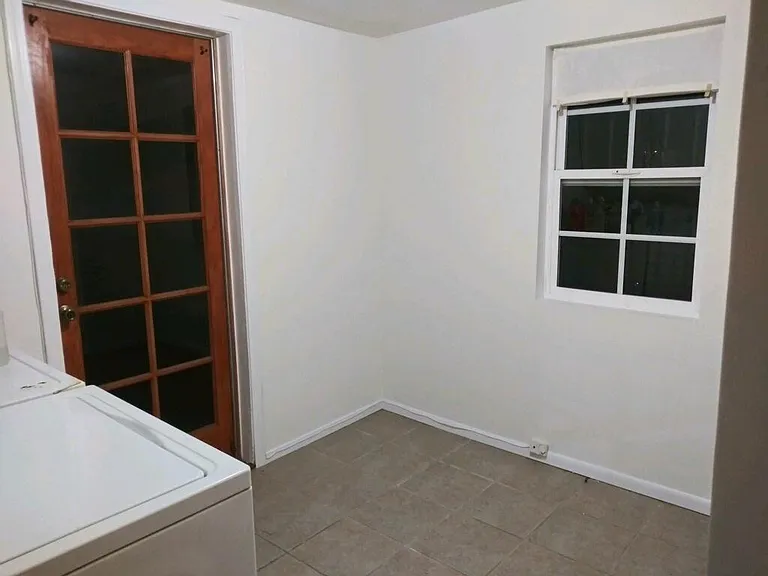 Laundry room with hookups (washer/dryer not included) and space for office/study/storage. Door leads to patio and yard.