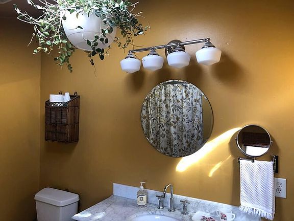 Bathroom renovated with Kohler fixtures, marble countertops and a deep soaking tub