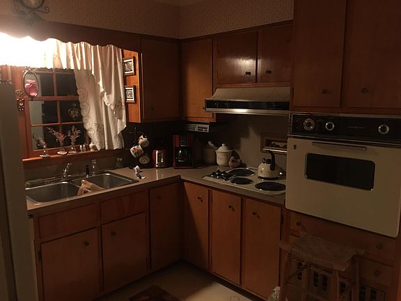 Fully furnished kitchen with attractive wood cabinets