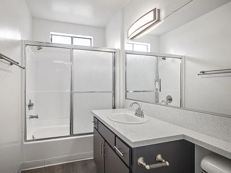Modern styled bathroom with shower and tub.