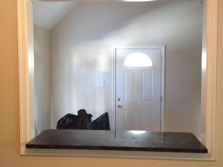 View of Den side door from kitchen Pass-thru