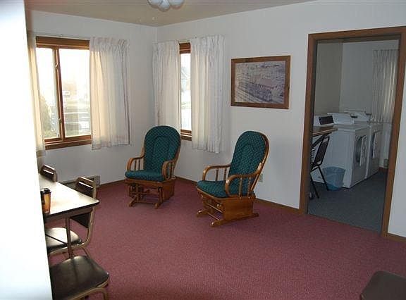 COMMUNITY ROOM LOOKING INTO LAUNDRY