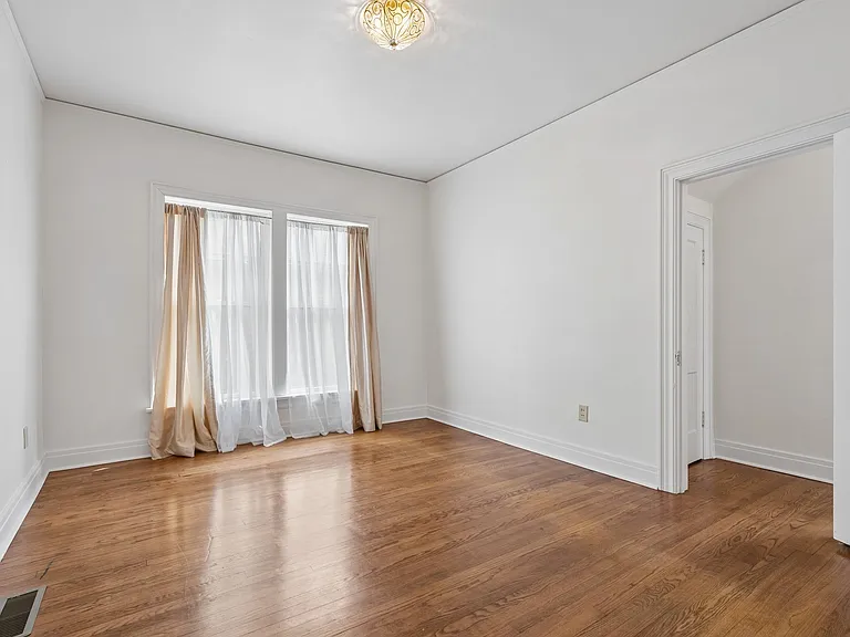 Bedroom 2. Door on right goes to transition room to rear exit and kitchen