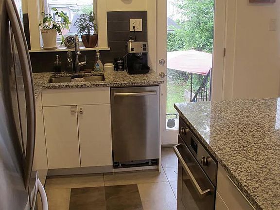 Kitchen overlooking the back yard and the garage.