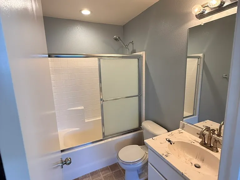 Full bathroom in loft. One sink, shower/tub combo.