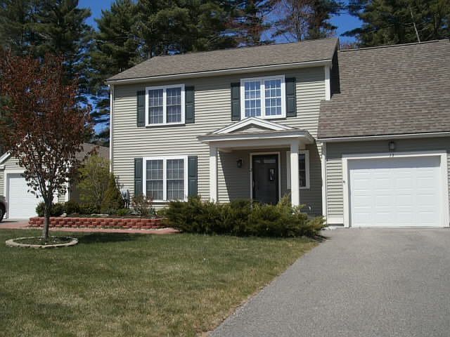 Front view w/both garages