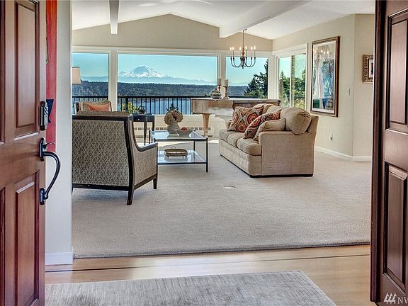 View living room has vaulted ceilings. Light and Bright even on a dark day!