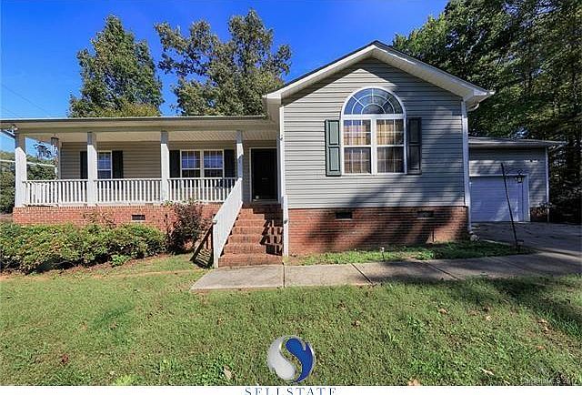 Adorable ranch style home on 2.44 acres in Troutman, NC. Fully insulated & dry-walled garage w/ work bench & added over head sto
