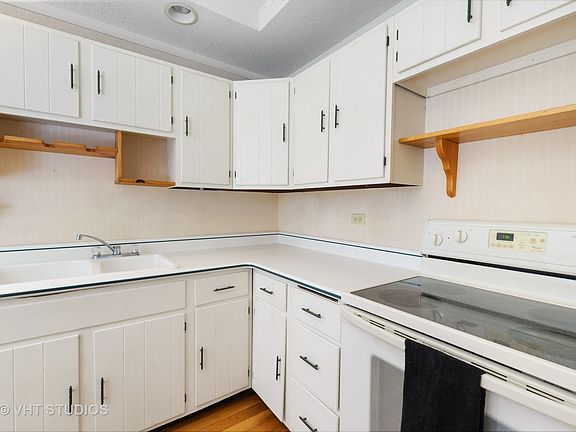 The kitchen is compact but could be moved if you wanted a bigger one to the library/bedroom #3 if yo