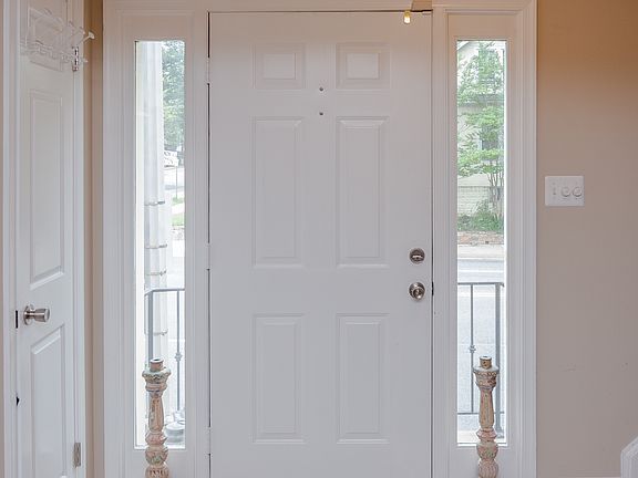 Well lit entry with hall closet