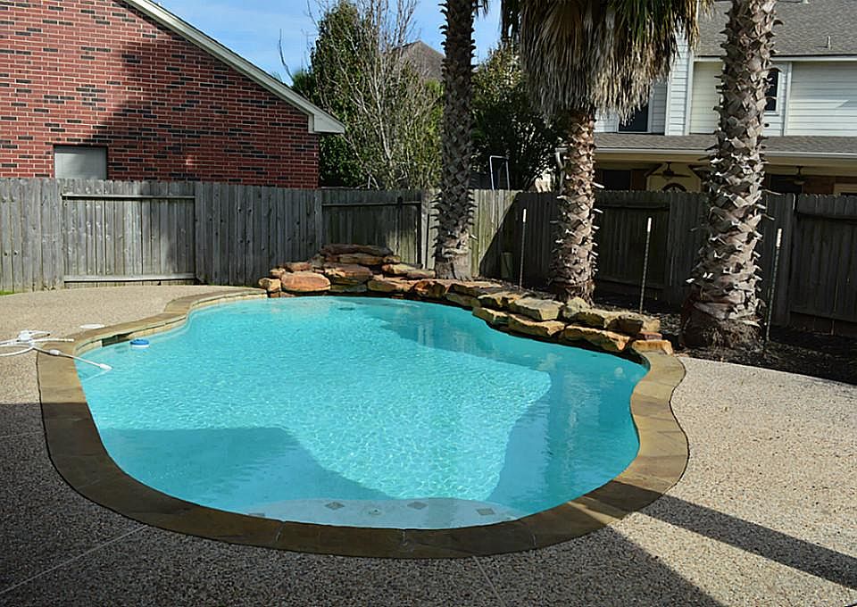 Your family will be so excited to play in their new pool w beautiful waterfall