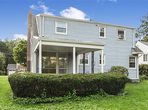 back of house with covered patio