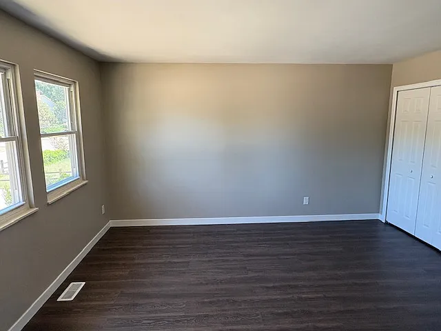 Primary bedroom has double closet.