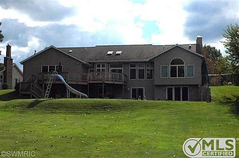 In-ground kidney shaped heated pool! Lots of windows to give you great views and lots of natural light!