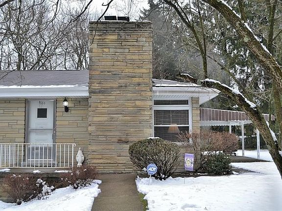 FRONT EXTERIOR:  A concrete walkway leads to the front porch and the covered side porch.  Note the 3-year old roof.