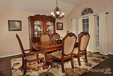 Formal Dining Room has large windows overlooking your front yard.