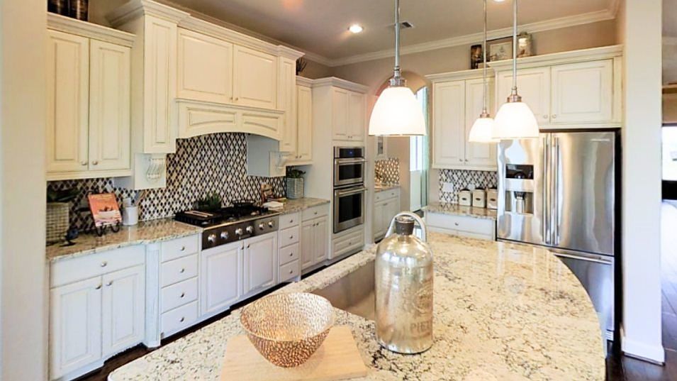 The gourmet kitchen is designed to accommodate family living and comes well-equipped with high-end a