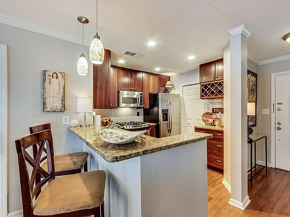 Modern Kitchen with Stainless Steel Appliances

Cook in style with sleek granite countertops, stainless steel appliances, and a convenient breakfast bar.