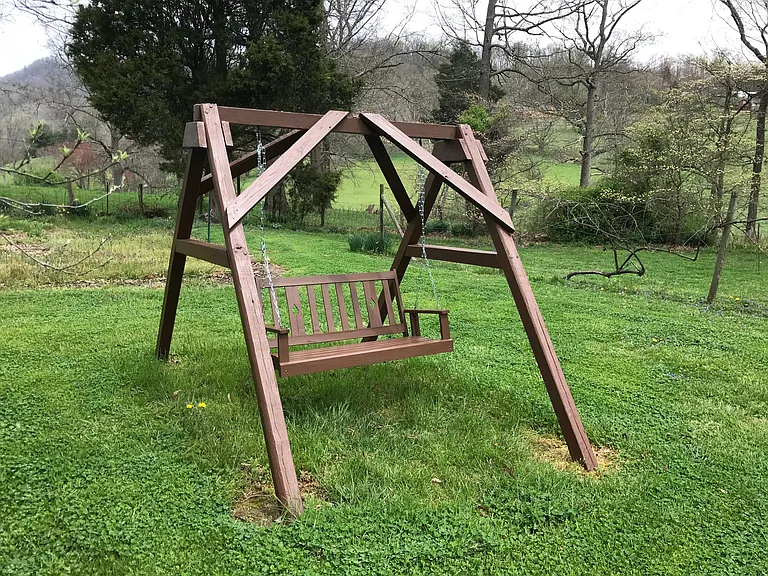 Large, level back yard with swing and garden spot. Owner provides lawn care.