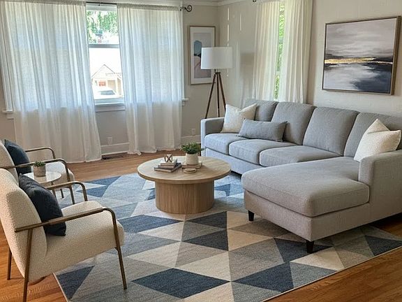 Staged view of living room. Curtains are velvet brown.