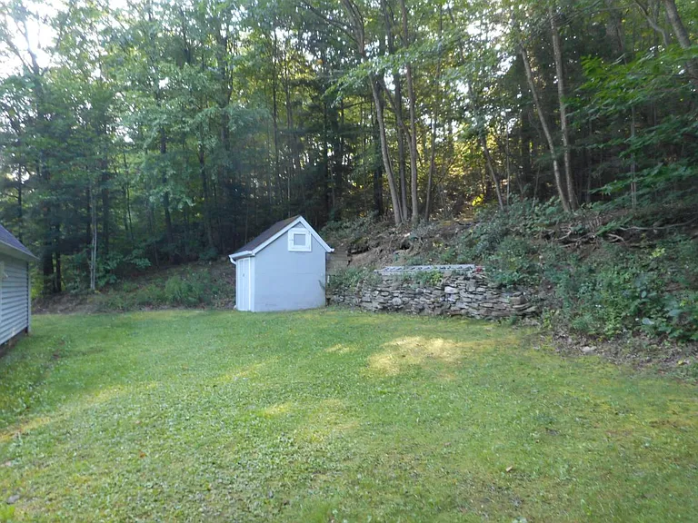 Private rear yard & storage shed.