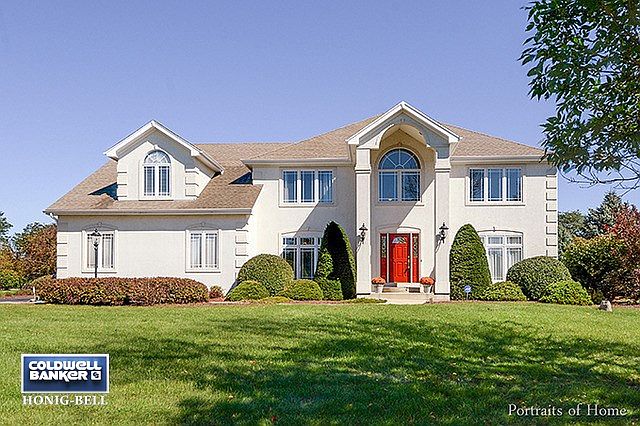 Impressive Front Exterior with Two Story Portico, Queen Anne Style Windows.