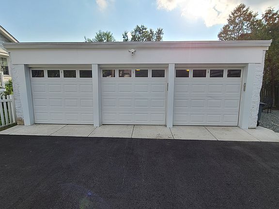 Middle garage designated for apt 2, exclusive parking spot in front
