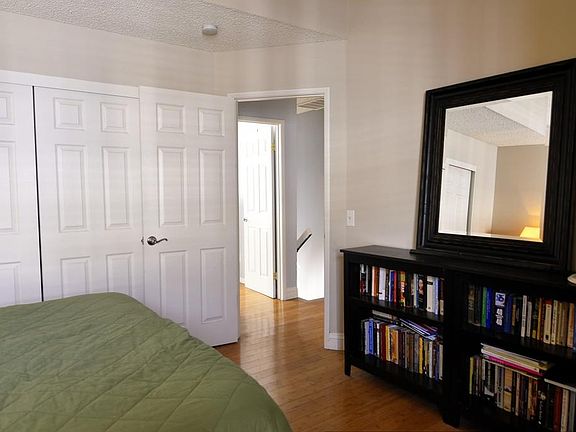 master bedroom w/ attached bathroom. High vaulted ceilings.