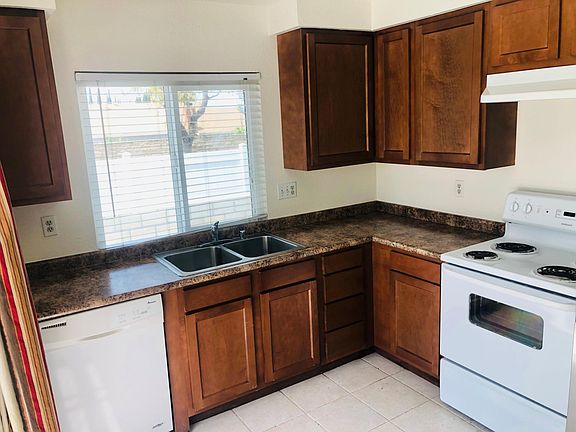 Kitchen; stove, oven, ventilation range, dishwasher, garbage disposal, double basin sink
