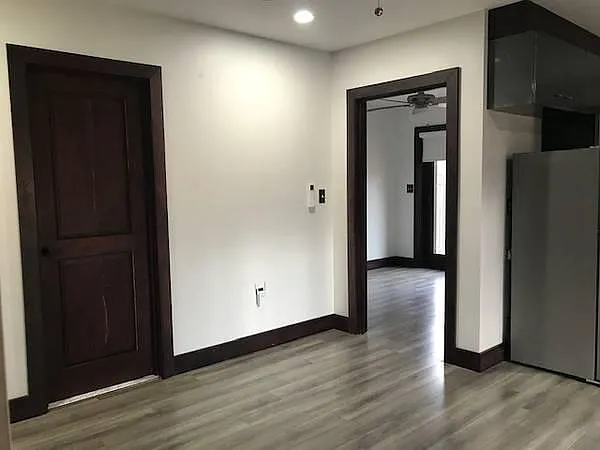Bathroom has dual access --from living room as well as hallway adjacent to bedroom
