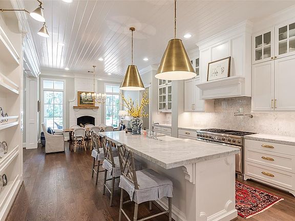 Modern Farm house Kitchen! This kitchen is amazing! Large Island, commercial style appliances!Carera Marble counter tops, Fireplace in breakfast area! Tons of drawers and cabinets!