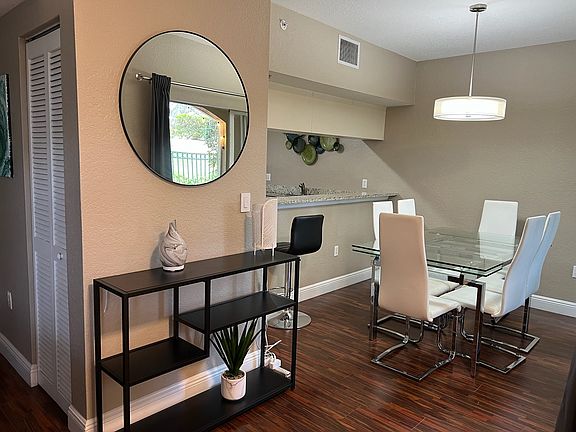 Entryway into dining room and kitchen bar