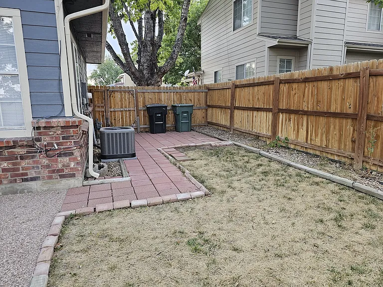 Back yard, front door is outside the gate