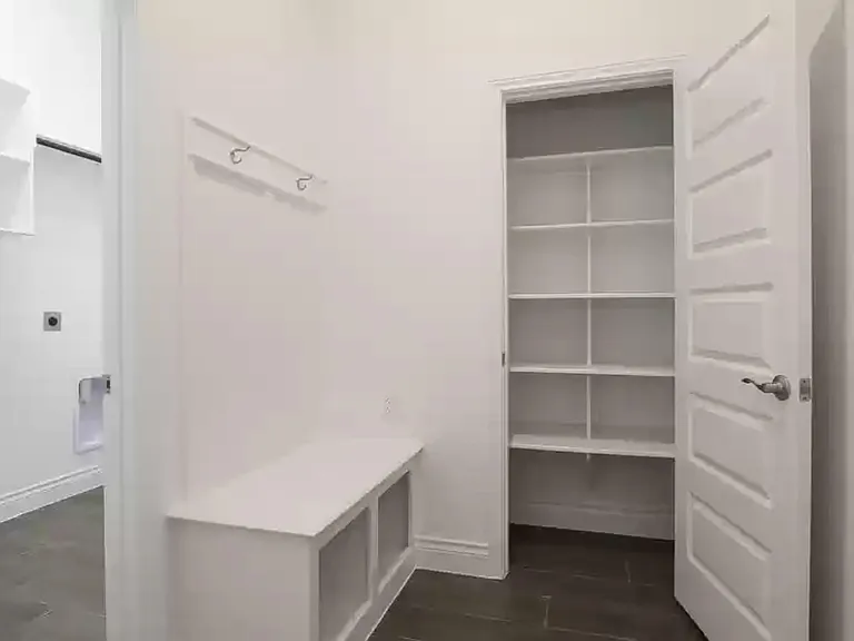 Mud room. Washer/dryer room to the left. Door to the garage on the right.