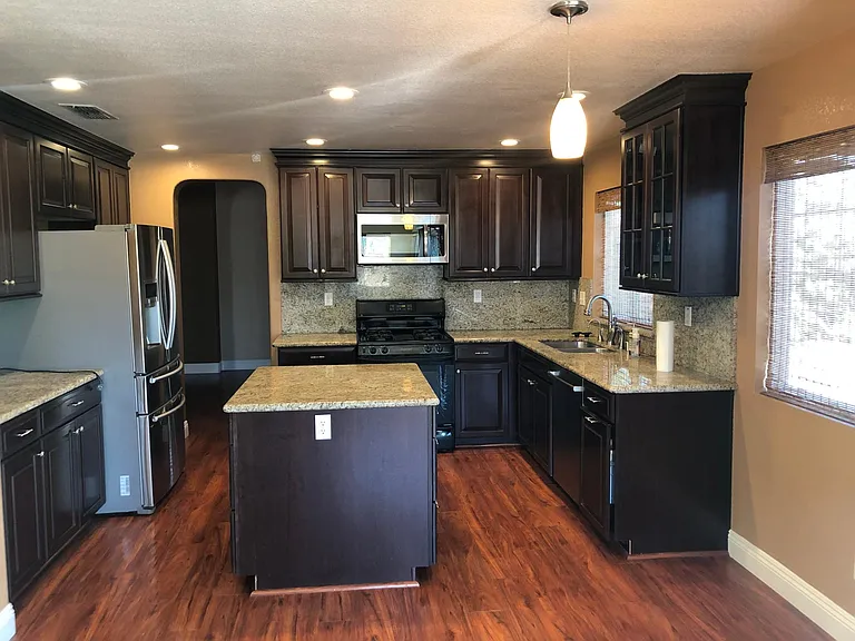 Kitchen with granite counter top (view from Family room)