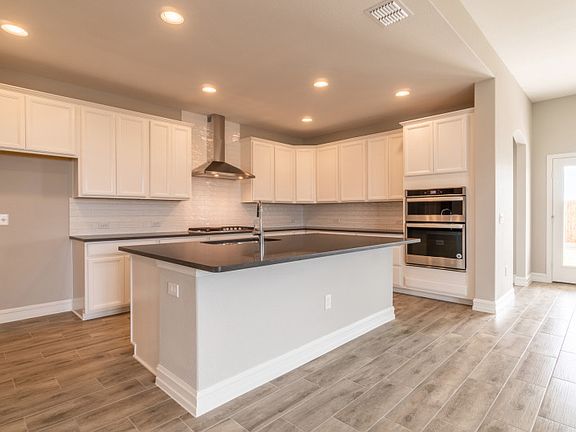 Built-in stainless steel appliances in kitchen