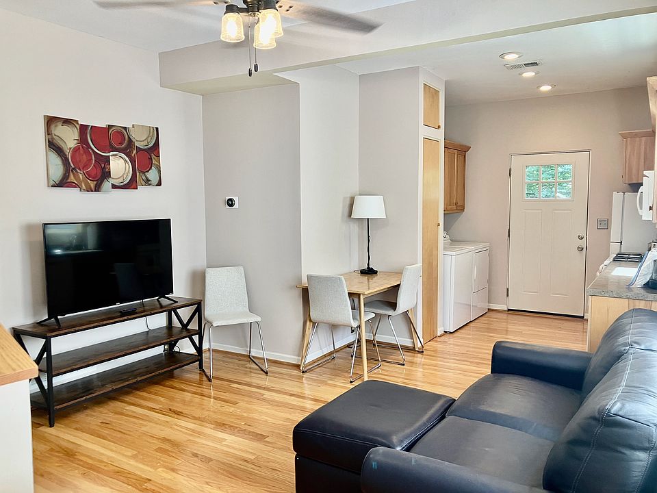 Comfortable social space with leather sofabed, TV, eating/working area, kitchen area with access to outdoor deck and laundry facilities (inside)