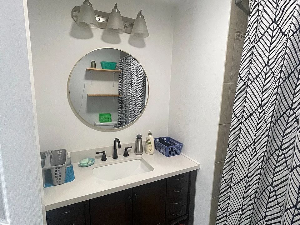 Full Bathroom with vanity and a shower