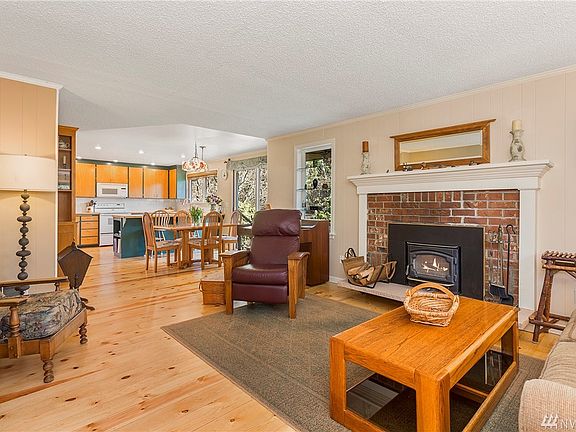 Through the front door you're welcomed in by a cozy fireplace, and great open living space.