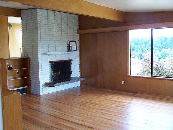 Relax in this spacious front room around a cozy fireplace 