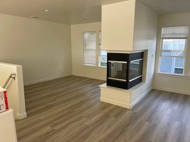 Living Room (upstairs) with a 3 sided fireplace gas fireplace