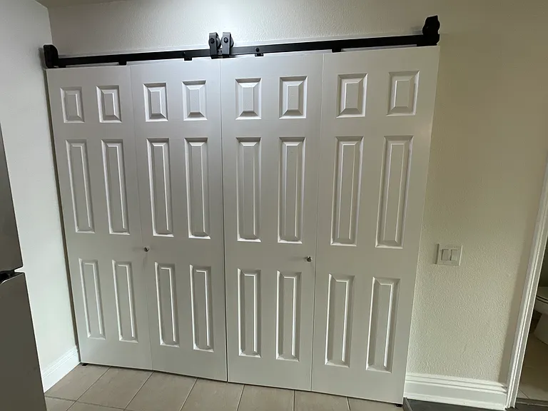 Barn doors concealing the laundry area