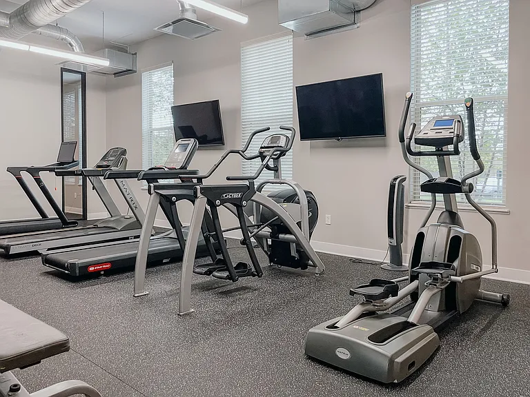 Experience fitness at its finest in our modern apartment gym, equipped for a complete workout.
