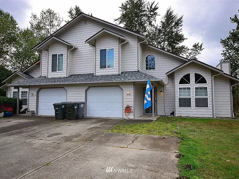 Beautifully updated duplex unit, fully fenced backyard on a quarter acre.