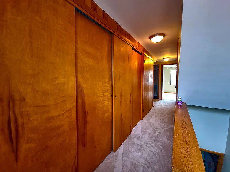 Upstairs hallway, whole wall of storage