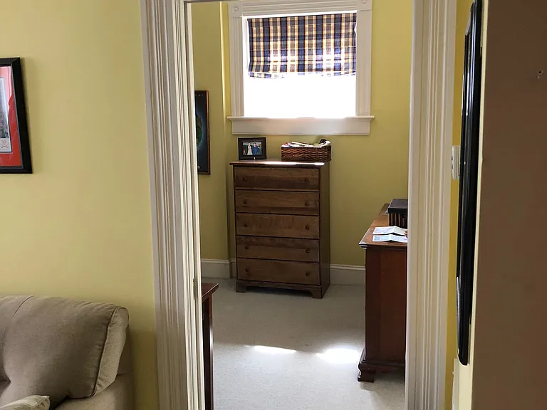 LIVING ROOM LOOKING INTO ENTRANCE TO BEDROOM