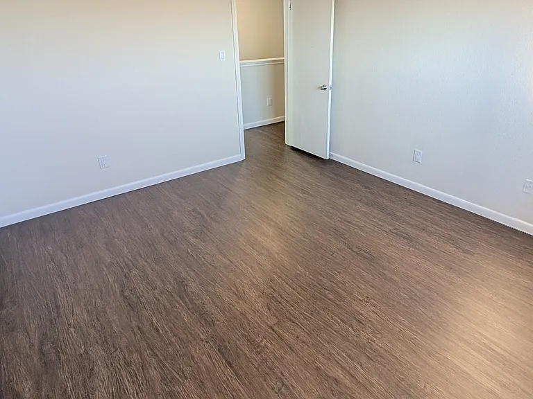 Bedroom facing South with street view